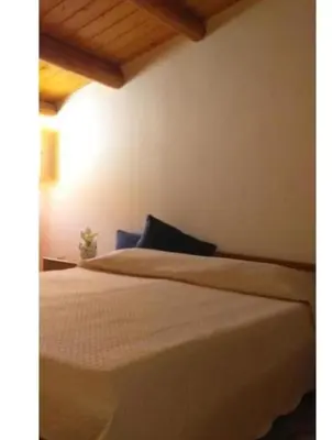 Letto o letti in una camera di Amuni Home