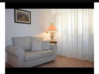 Area soggiorno di Amuni Home