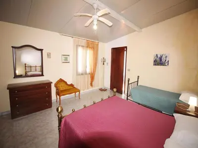 Letto o letti in una camera di Spacious villa with a large veranda and pool