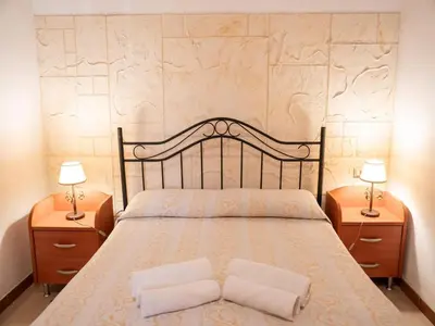 Letto o letti in una camera di Spacious villa with a large veranda and pool