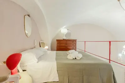 Letto o letti in una camera di GuestHost - Charming Red Flat