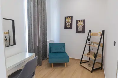 Letto o letti in una camera di LIONS ROOMS Augusta
