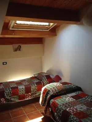 Letto o letti in una camera di Mansarda Ulivo