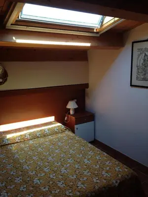 Letto o letti in una camera di Mansarda Ulivo