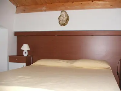 Letto o letti in una camera di Mansarda Ulivo