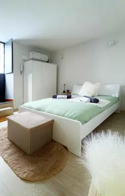 Letto o letti in una camera di NestCity