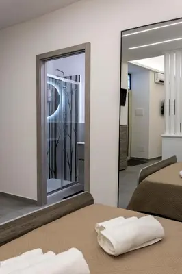 Letto o letti in una camera di Cinere Ursino