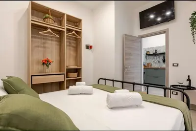 Letto o letti in una camera di C'est la vie Catania
