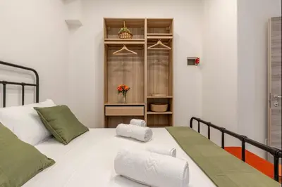 Letto o letti in una camera di C'est la vie Catania