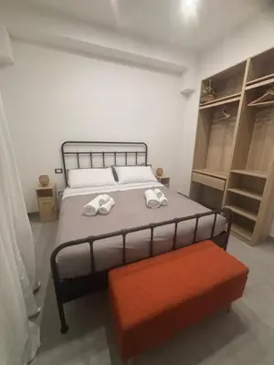 Letto o letti in una camera di C'est la vie Catania