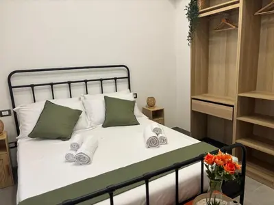 Letto o letti in una camera di C'est la vie Catania