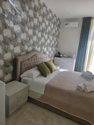 Letto o letti in una camera di New Golden house sicily