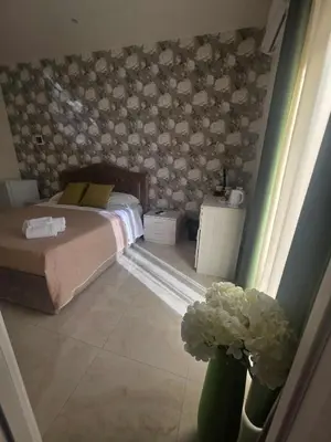 Letto o letti in una camera di New Golden house sicily