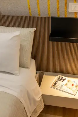 Letto o letti in una camera di Naos 71- Appartamento con balcone vicino Ortigia