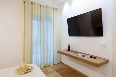 TV o dispositivi per l'intrattenimento presso Naos 71- Appartamento con balcone vicino Ortigia