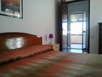 Letto o letti in una camera di Terrazza sul Mar Ionio a 150m dalla spiaggia