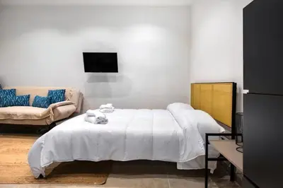 Letto o letti in una camera di Ortigia - Domus Olea New Apartment near the Beach