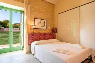 Letto o letti in una camera di Casa Gna Razia - IsulaTravel
