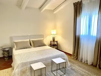 Letto o letti in una camera di Villa Nivara
