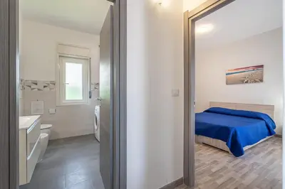 Letto o letti in una camera di villa con piscina vista mare