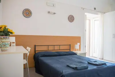 Letto o letti in una camera di Caleidoscopio Rosso