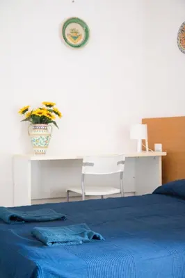 Letto o letti in una camera di Caleidoscopio Rosso