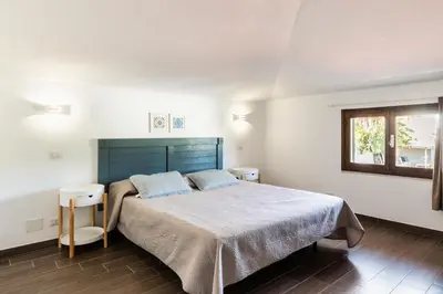 Letto o letti in una camera di A Due passi dal Mare Villas