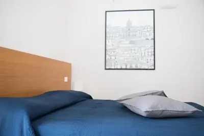 Letto o letti in una camera di Caleidoscopio Bianco