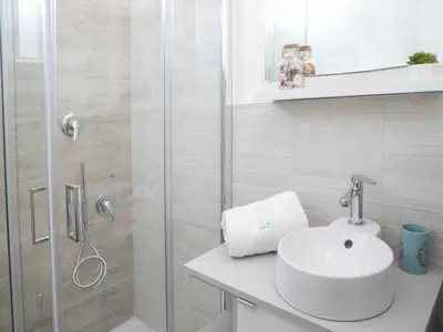 Bagno di Apartment Edoné- Wohnung mit Blick auf einen Sandstrand by Interhome