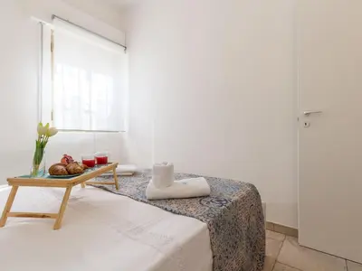 Letto o letti in una camera di Apartment Edoné- Wohnung mit Blick auf einen Sandstrand by Interhome
