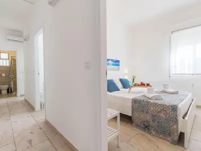 Letto o letti in una camera di Apartment Edoné- Wohnung mit Blick auf einen Sandstrand by Interhome