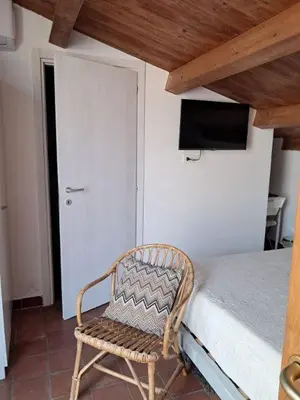 Letto o letti in una camera di Casa Antioco B&B
