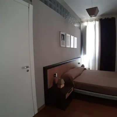 Letto o letti in una camera di Casa Antioco B&B