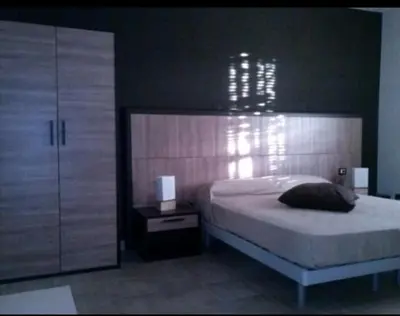 Letto o letti in una camera di Casa Antioco B&B