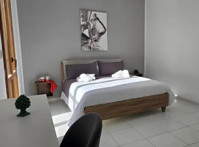 Letto o letti in una camera di La Balza Suites-Sole by Ortigia Apartments