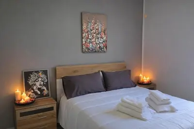 Letto o letti in una camera di La Balza Suites-Sole by Ortigia Apartments