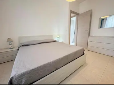 Letto o letti in una camera di Villa Marzamemi