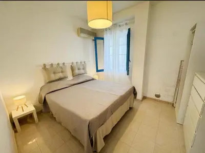 Letto o letti in una camera di Villa Marzamemi