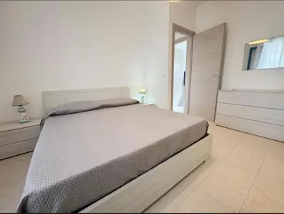 Letto o letti in una camera di Villa Marzamemi