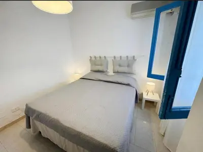 Letto o letti in una camera di Villa Marzamemi
