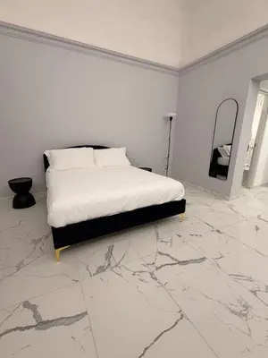 Letto o letti in una camera di Vulcano Rooms 2