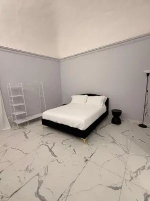 Letto o letti in una camera di Vulcano Rooms 2