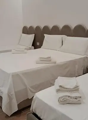 Letto o letti in una camera di Ursino inn camere e suite