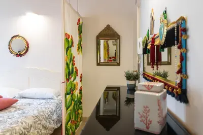 Letto o letti in una camera di GuestHost - Quattro Cuori Ortigia Comfy Studio