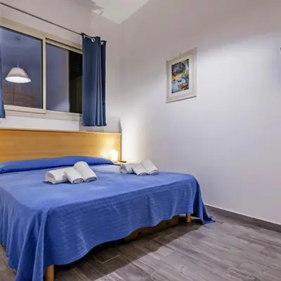 Letto o letti in una camera di Agatocle Residence Ortigia