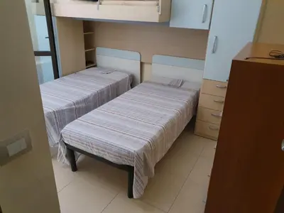 Letto o letti in una camera di Villa Eloro