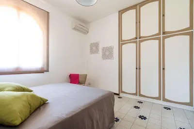 Letto o letti in una camera di Villa Mari - Sea View Heated Pool - Baia del Riccio