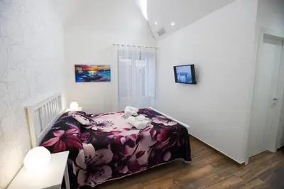 Letto o letti in una camera di Premiere Luxury Catania