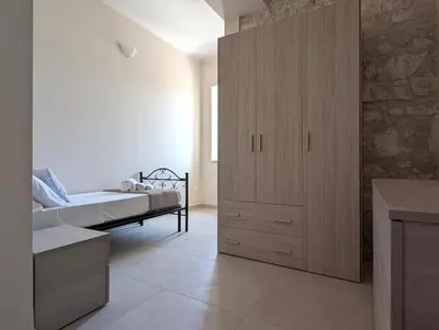 Letto o letti in una camera di Casa Perry