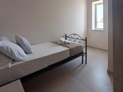 Letto o letti in una camera di Casa Perry